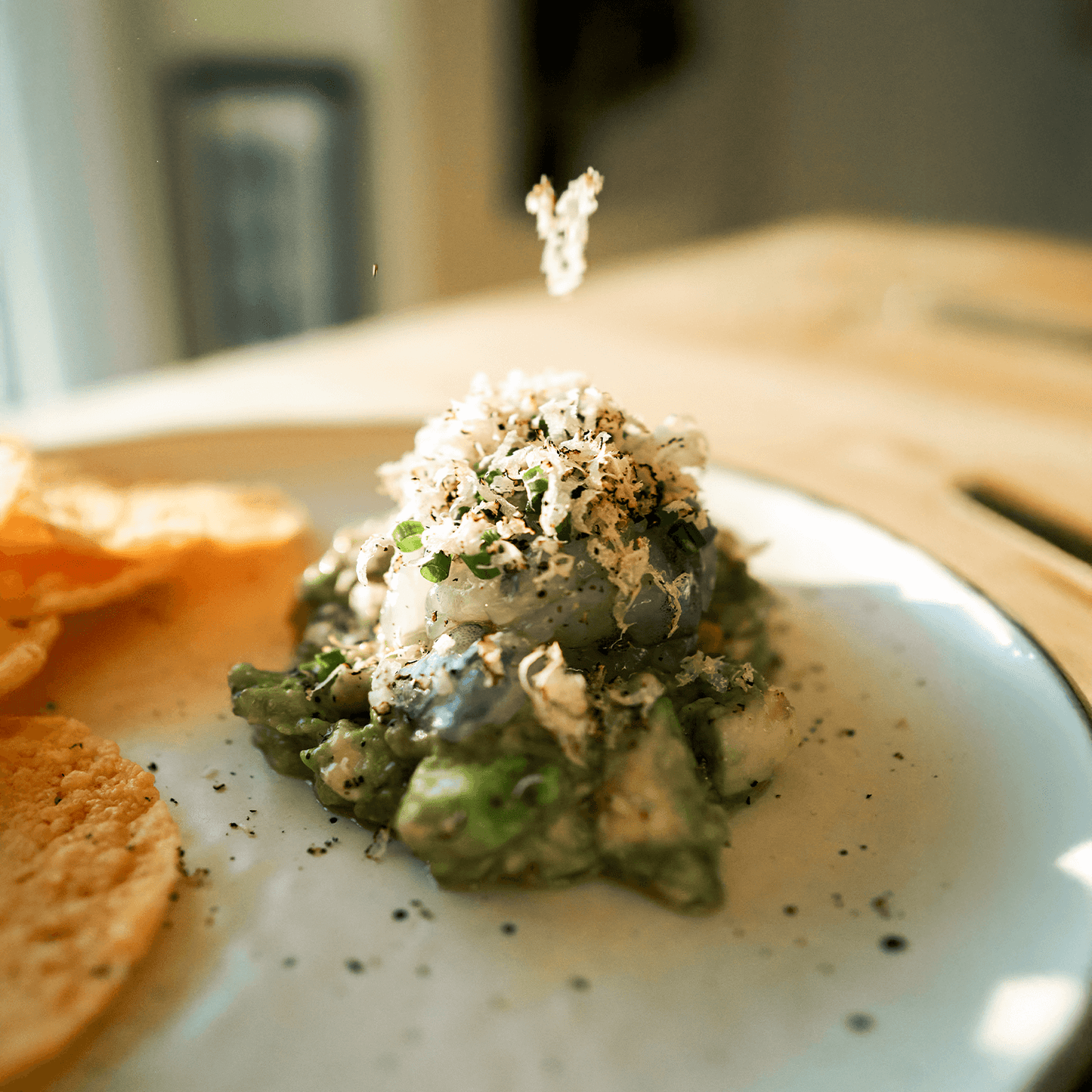 A whole Italian Black Summer Truffle on a wooden board